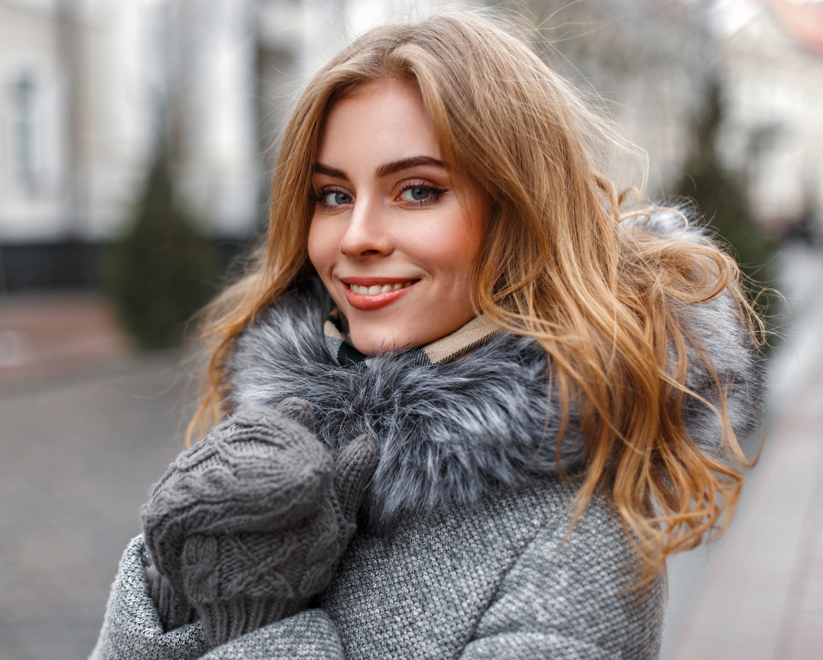 Strawberry blonde woman smiling
