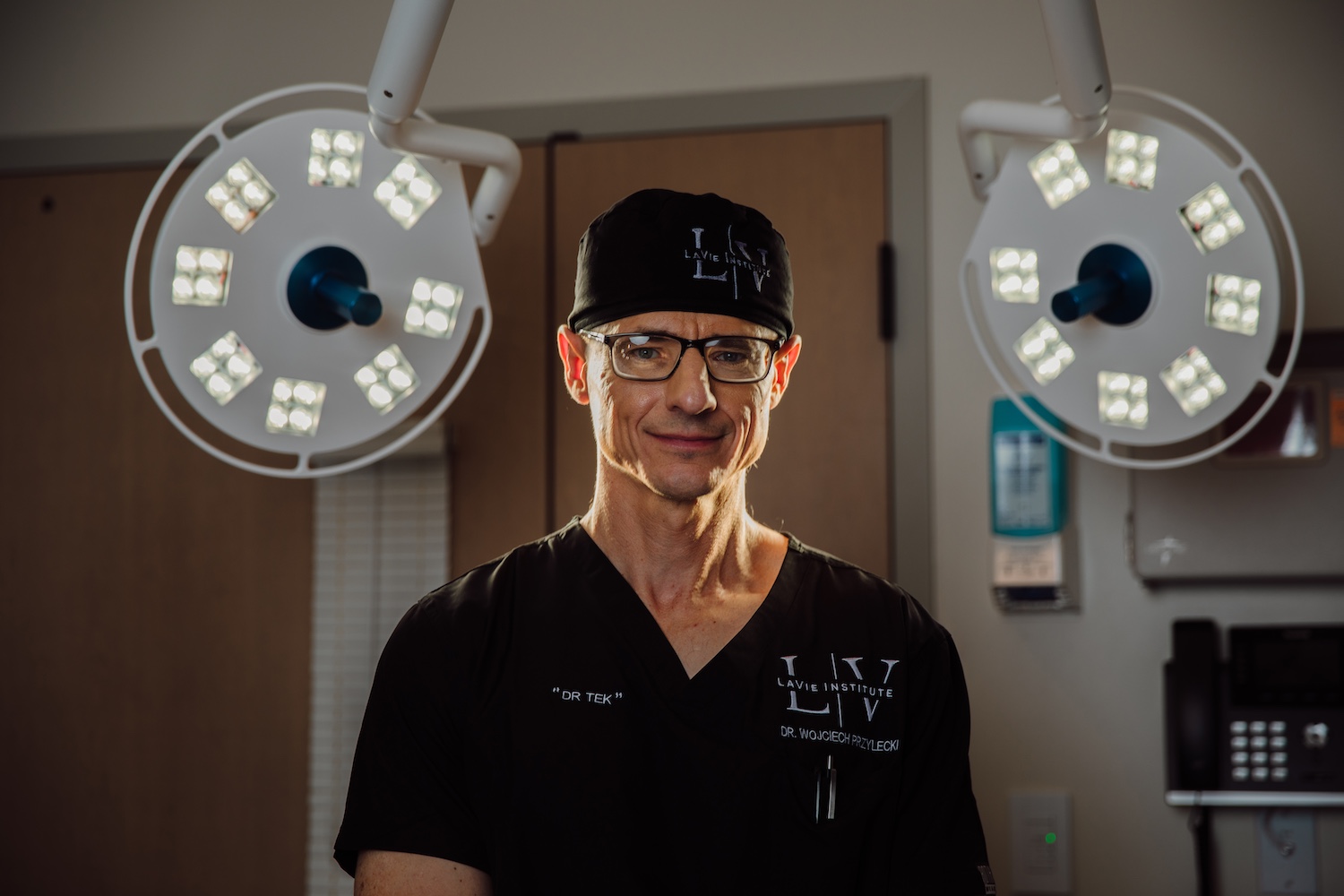 Dr. Wojciech Przylecki with The LaVie Institute in black scrubs